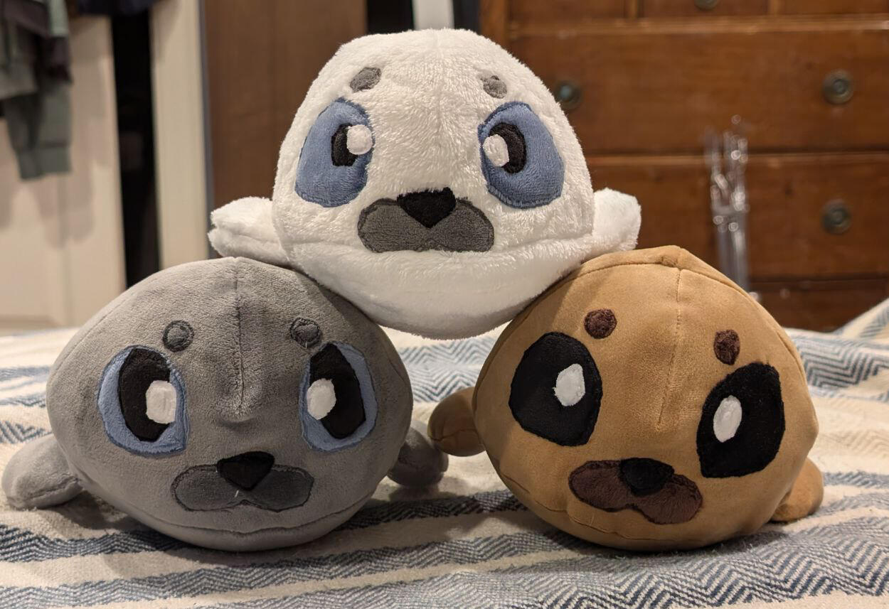 A pile of baby seal plushies